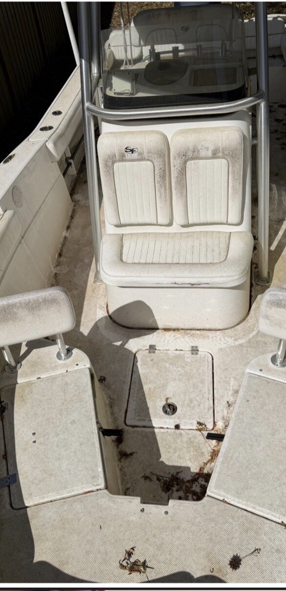 Boat before soft washing — hull grime and salt buildup