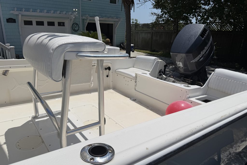 Center-console boat deck after soft washing — bright white and clean