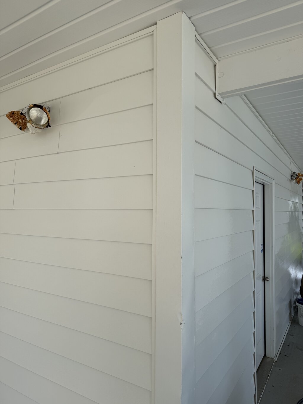 Foundation corner after soft washing — clean and restored