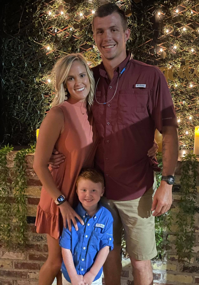 Josh and his family together in Brunswick County